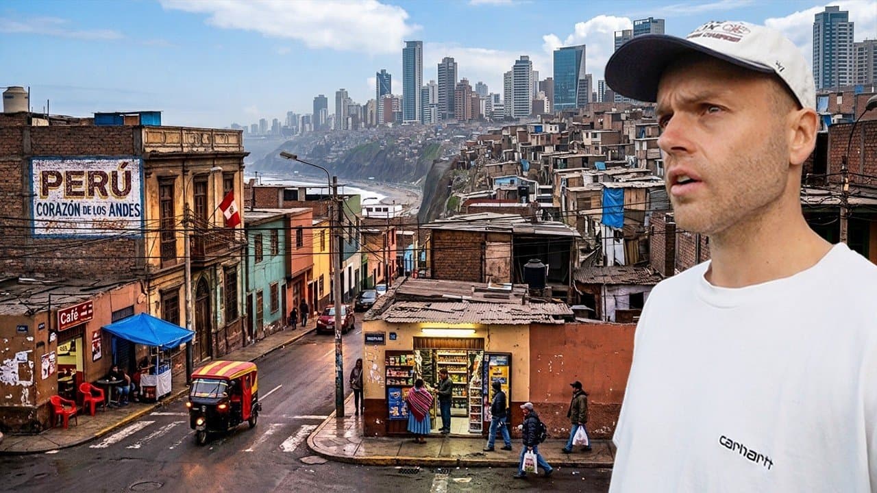 Nick Fisher in a white cap and white Carhartt T-shirt on a street corner in Lima, a painted Perú, Corazón de los Andes sign and a red mototaxi behind him, the cliffs and high-rises of the coast in the distance